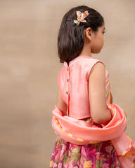 Girl in festive pink floral lehenga set with embroidered crop top – handcrafted kids ethnic wear by LAAD