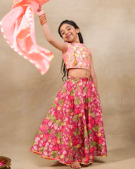 Girl in festive pink floral lehenga set with embroidered crop top – handcrafted kids ethnic wear by LAAD