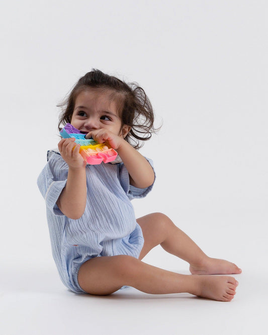 This adorable baby romper is inspired by the magic of "Under the Sea"!   It features a cute white collar & refreshing blue, perfect for summer. Easy snaps for diaper changes & thoughtful design for comfort.  