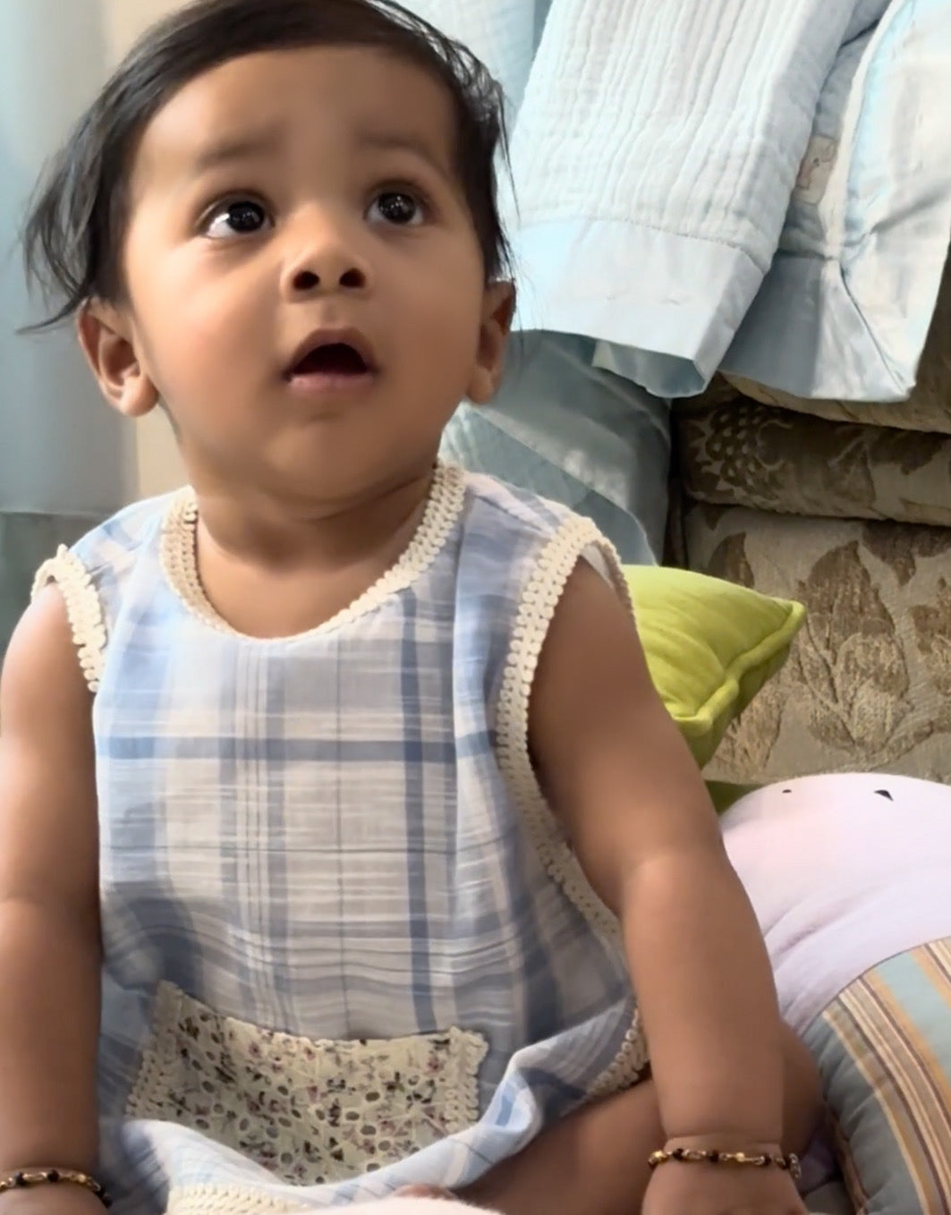  baby in LAAD`S  soft blue plaid jhabla featuring delicate lace trim and a floral pocket, paired with diaper cover