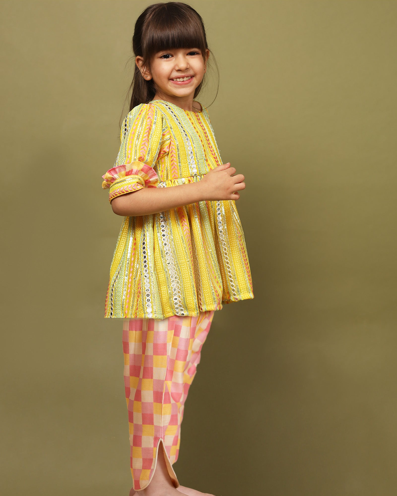 Sun-kissed mirror peplum with dhoti is perfect for festive occasions! Comfortable cotton lining, snap button closure, 3/4 sleeves with frill cuffs, and stylish checkered dhoti with side opening by laadindia.com