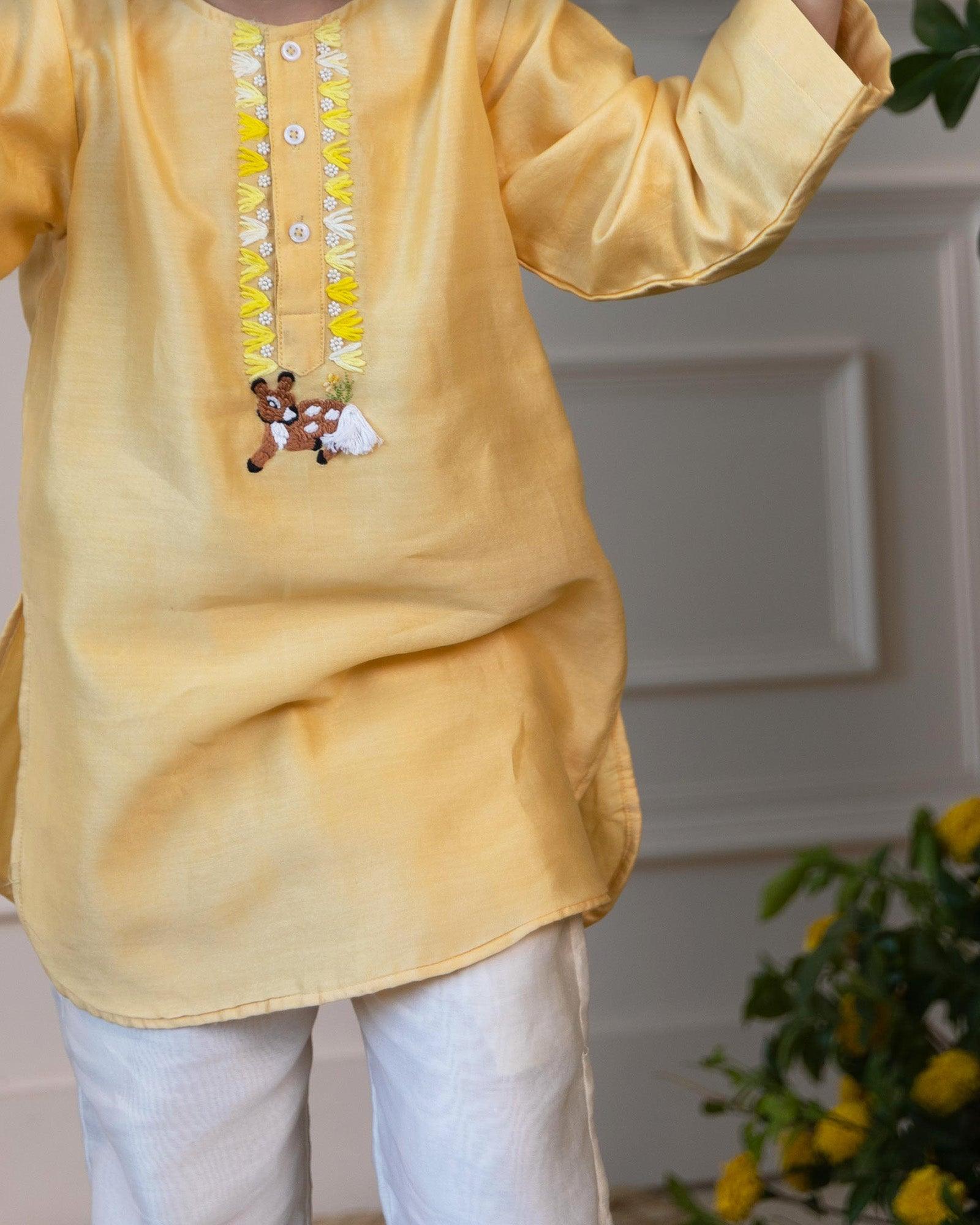 Elegant yellow kurta pyjama set for kids by Laad India, featuring delicate beadwork, intricate hand embroidery of a bambi, and a soft cotton lining for ultimate comfort. Perfect ethnic wear for festive occasions and celebrations