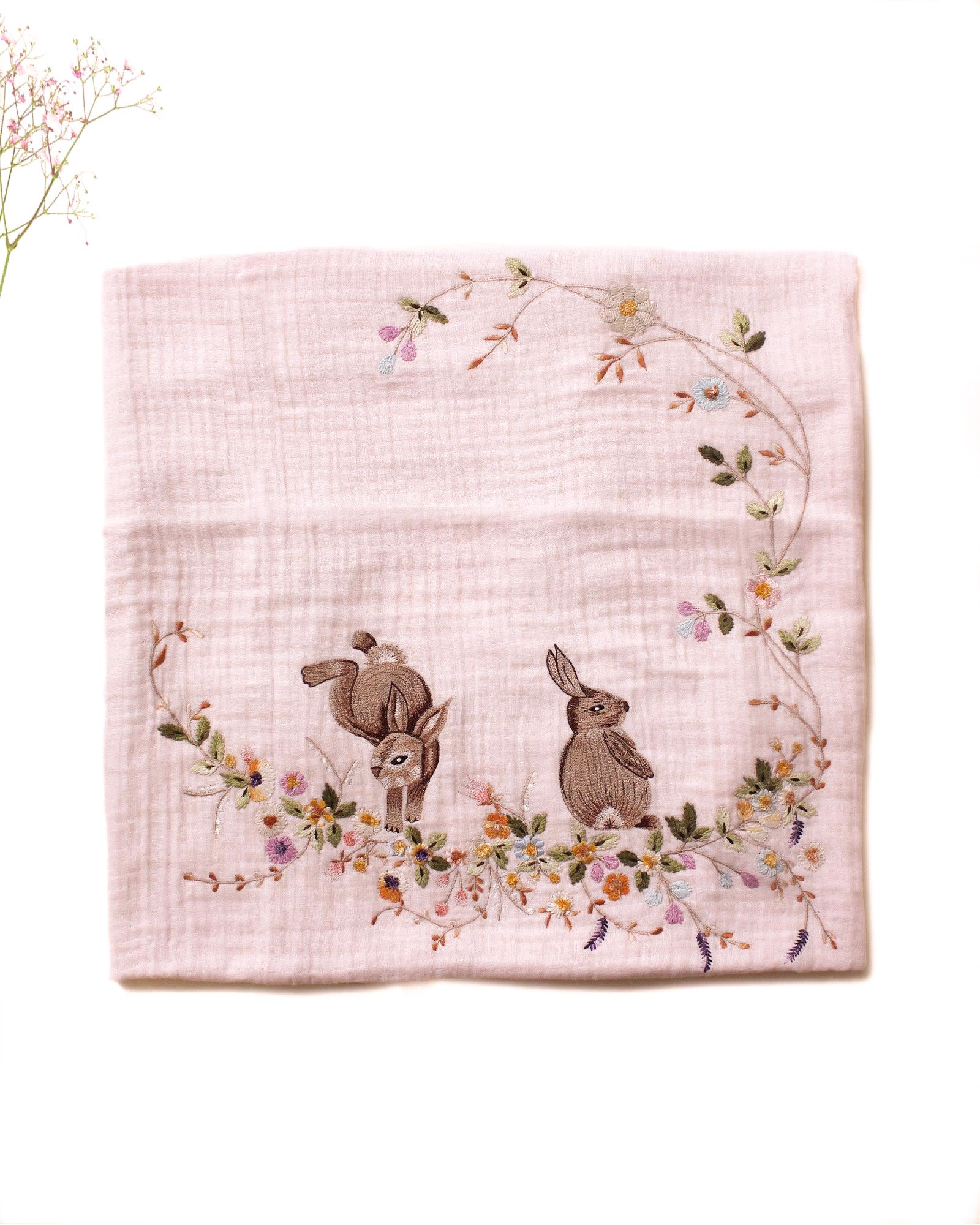 Soft touch of fushia bunny dohar for baby with delicate embroidery featuring two bunnies surrounded by a floral wreath. Made from lightweight, breathable fabric with a satin border perfect for cozy naps and gentle on baby’s skin.
