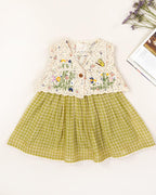 LAAD`S kid in Titalee moss green dress by Laad India, featuring delicate floral embroidery, an eyelet lace bodice, and a gingham checkered dress. A perfect blend of vintage elegance and modern comfort for your little one