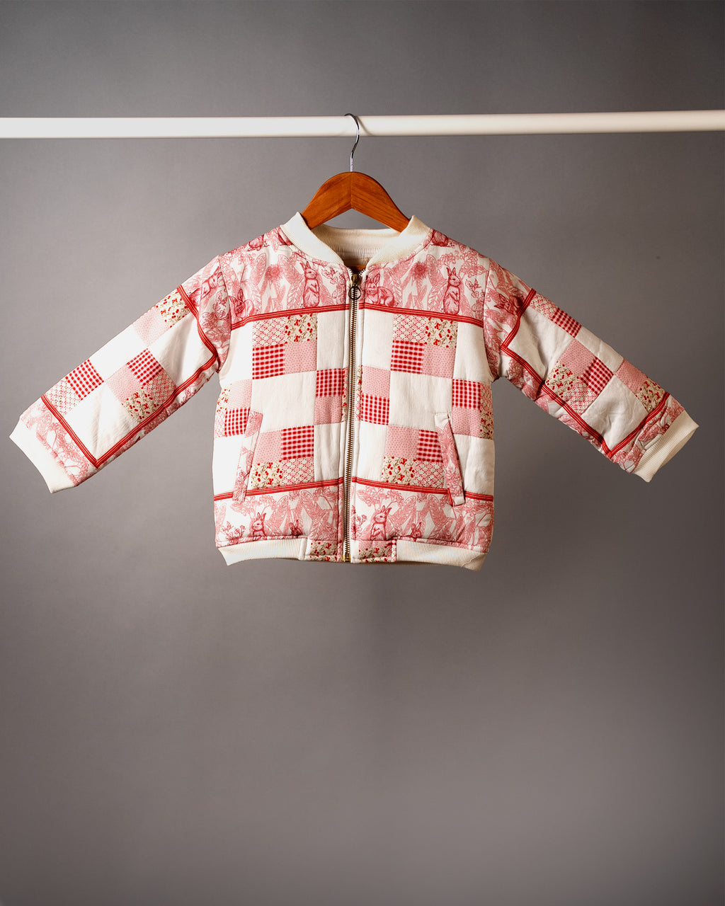 girl wearing laad's scralet colour white rabbit ptchwork bomber jacket