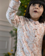 laad`s kid wearing a long-sleeved woodland print kurta with intricate nature-inspired motifs, paired with white pyjama. perfect for festive or special occasions