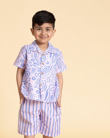 Aline fun print half-sleeve ameba co-ord boy`s holiday shirt and shorts  featuring wooden buttons and stylish strips . A perfect boy`s matching co-ord set and girls co-ord set .