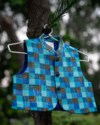 Azure mocha waist coat  featuring a luxurious silk Chanderi check pattern. The waist coat boasts intricate embroidery, a classic bandhgala collar, detailed look for festive occasions.