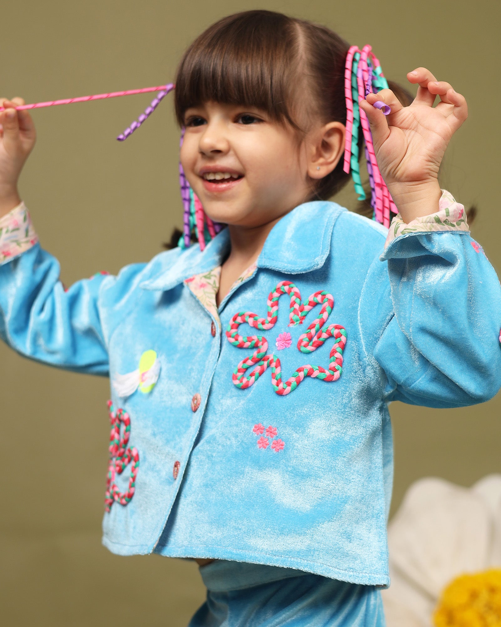 A luxurious baby blue braided velvet co-ord set designed for ultimate comfort and style. The top features intricate hand-embroidered detailing, soft cotton lining, and a front-open button design with full sleeves that can be styled with folded cuffs, making it perfect for keeping little ones cozy and fashionable during winter.