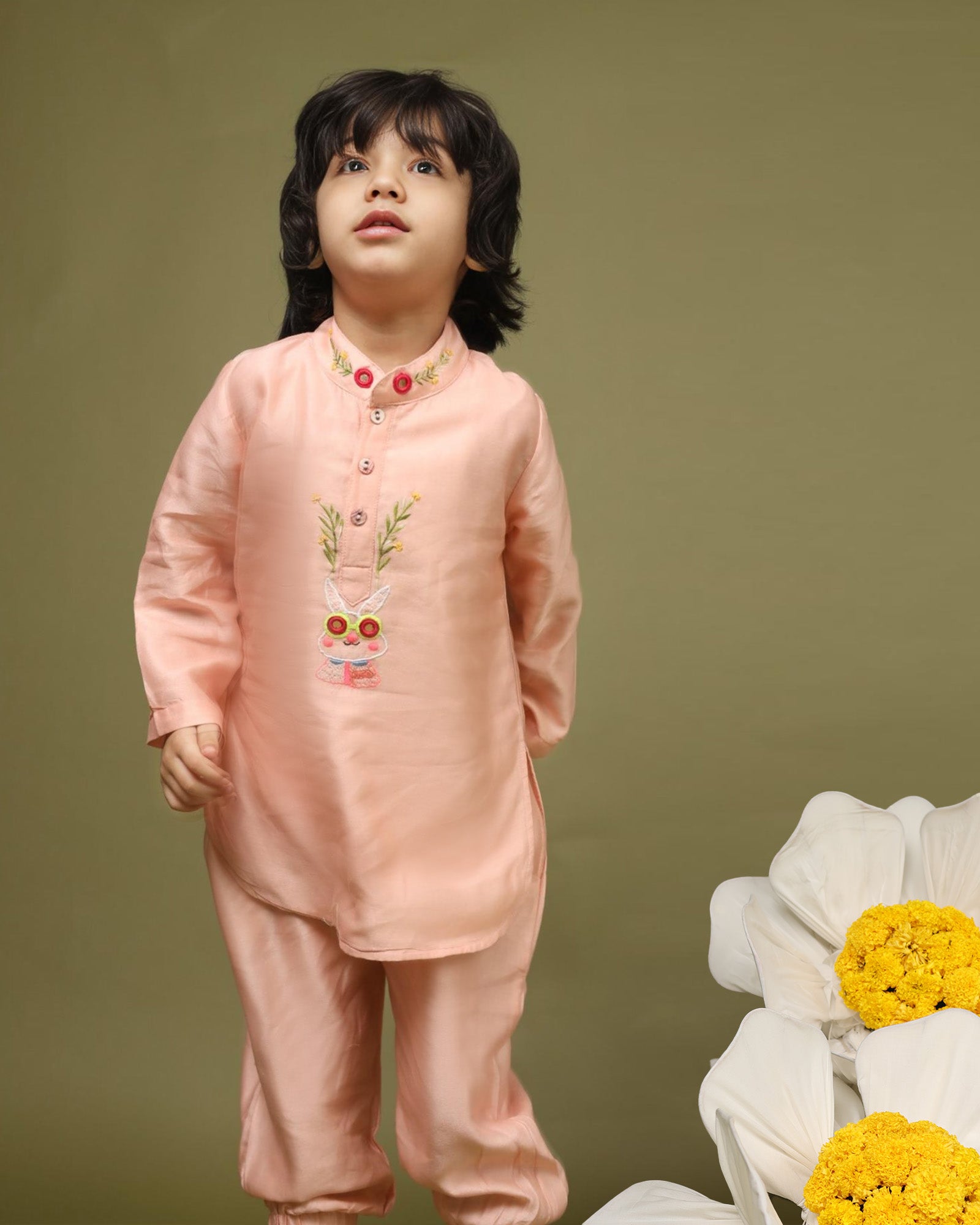 Playful, bright, colorful full-sleeve bandhgala Bunny blush kurta pyjama set. Intricate embroidery featuring bunny blush kurta , shimmering mirror work. Fun buttons add a pop of color. Elastic trousers. Soft cotton lining for comfort by laadindia.com