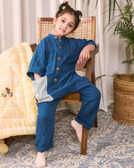 Dress your little one in LAAD's Bunny Jumpsuit, featuring a bandhgala collar, wooden buttons, and hand-embroidered Peter Rabbit details. Elegant, playful, and travel-ready!