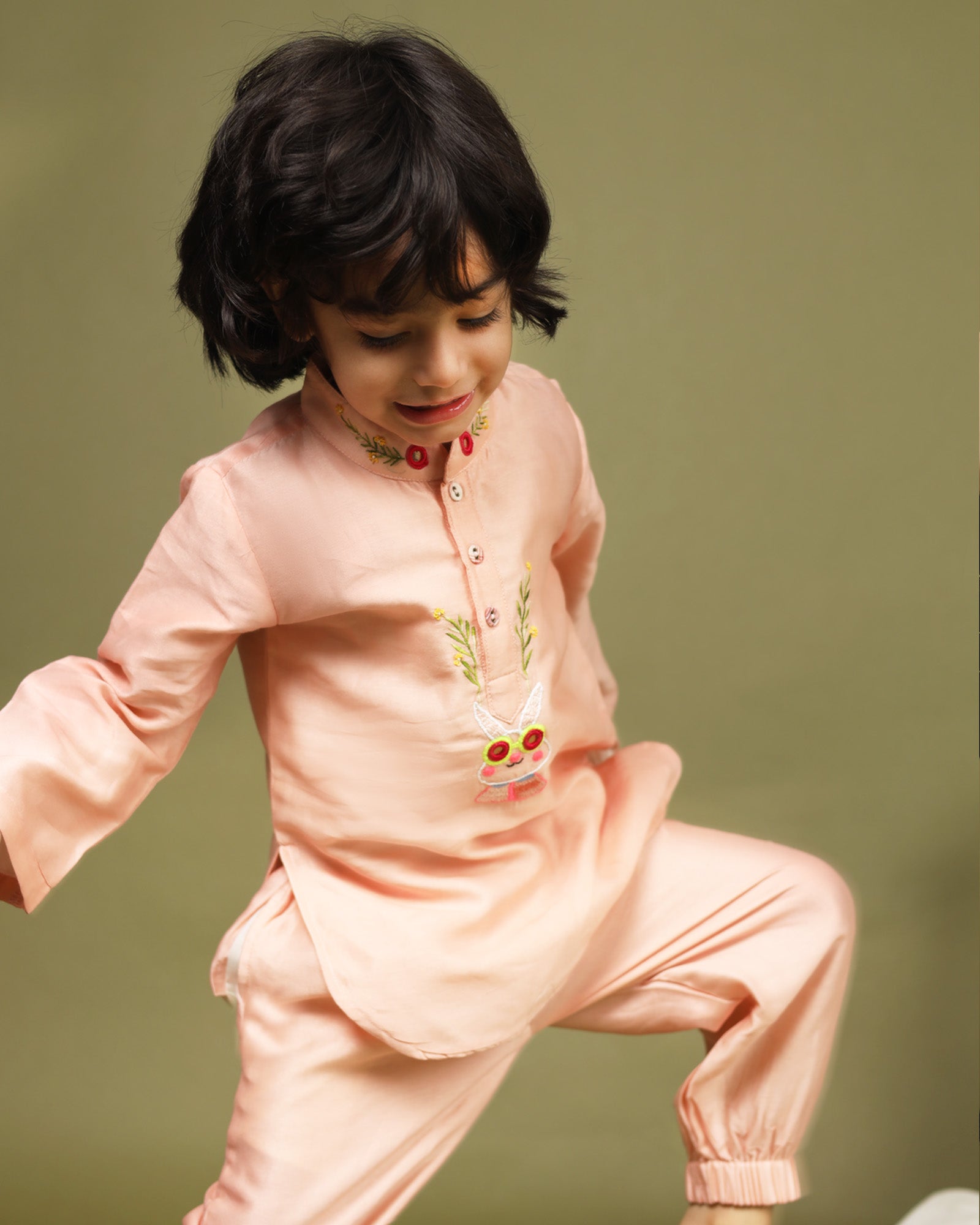 Playful, bright, colorful full-sleeve bandhgala Bunny blush kurta pyjama set. Intricate embroidery featuring bunny blush kurta , shimmering mirror work. Fun buttons add a pop of color. Elastic trousers. Soft cotton lining for comfort by laadindia.com