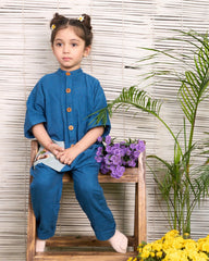 Dress your little one in LAAD's Bunny Jumpsuit, featuring a bandhgala collar, wooden buttons, and hand-embroidered Peter Rabbit details. Elegant, playful, and travel-ready!