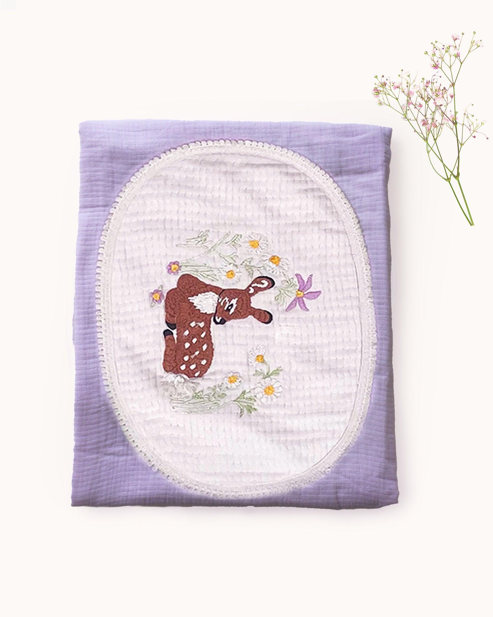 This hand-embroidered Bambi Deer Dohar, crafted from 100% cotton muslin, features a delicate deer surrounded by vibrant floral meadows. Soft and luxurious, perfect for dreamy sleep up to 3 years.