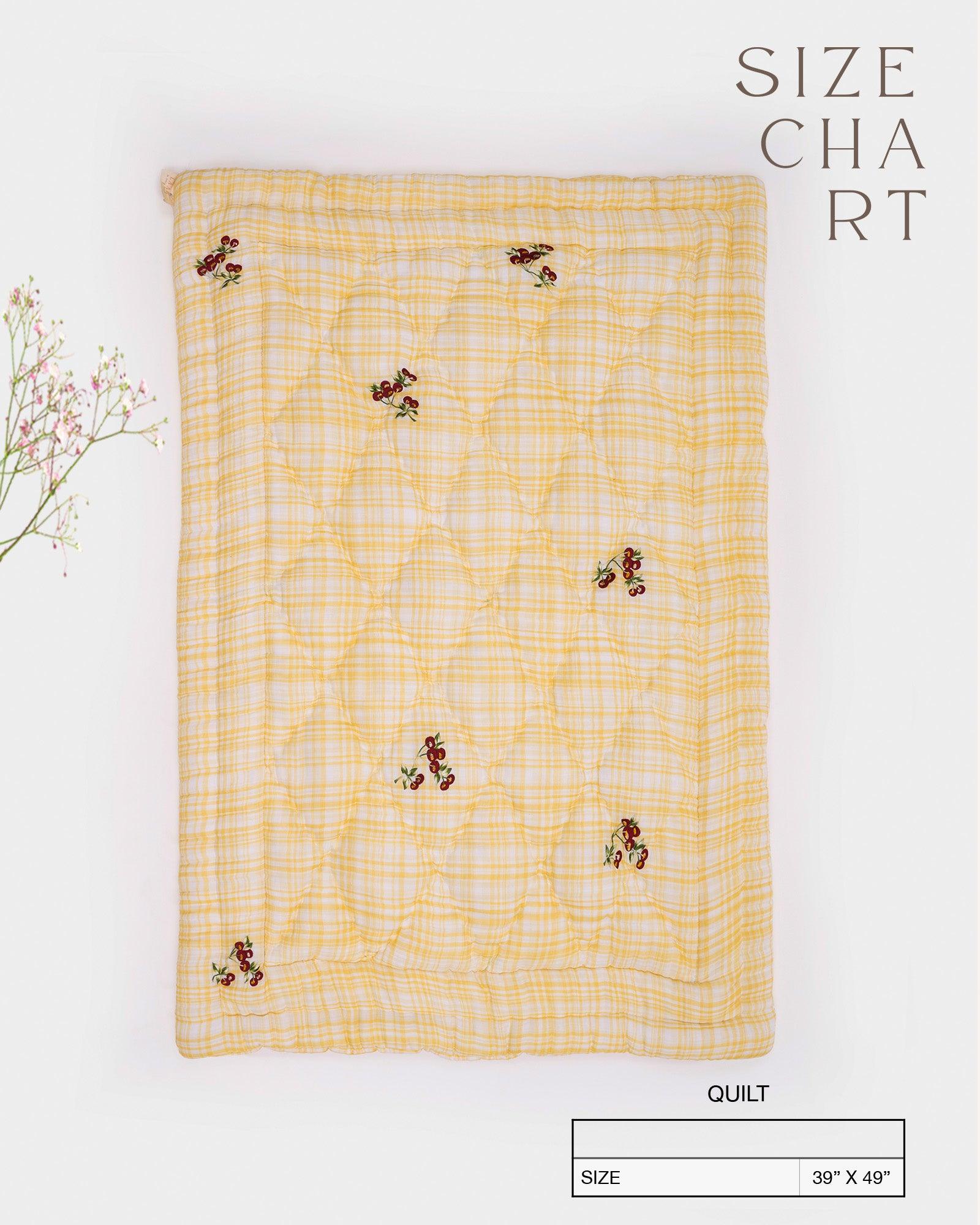 Delightful quilt features embroidered cherries & blends seamlessly with any nursery. Soft cotton & cozy filling for ultimate comfort.