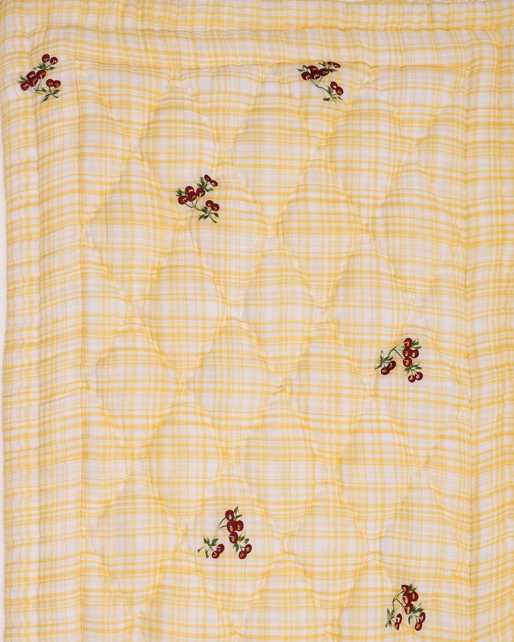 Delightful quilt features embroidered cherries & blends seamlessly with any nursery. Soft cotton & cozy filling for ultimate comfort.