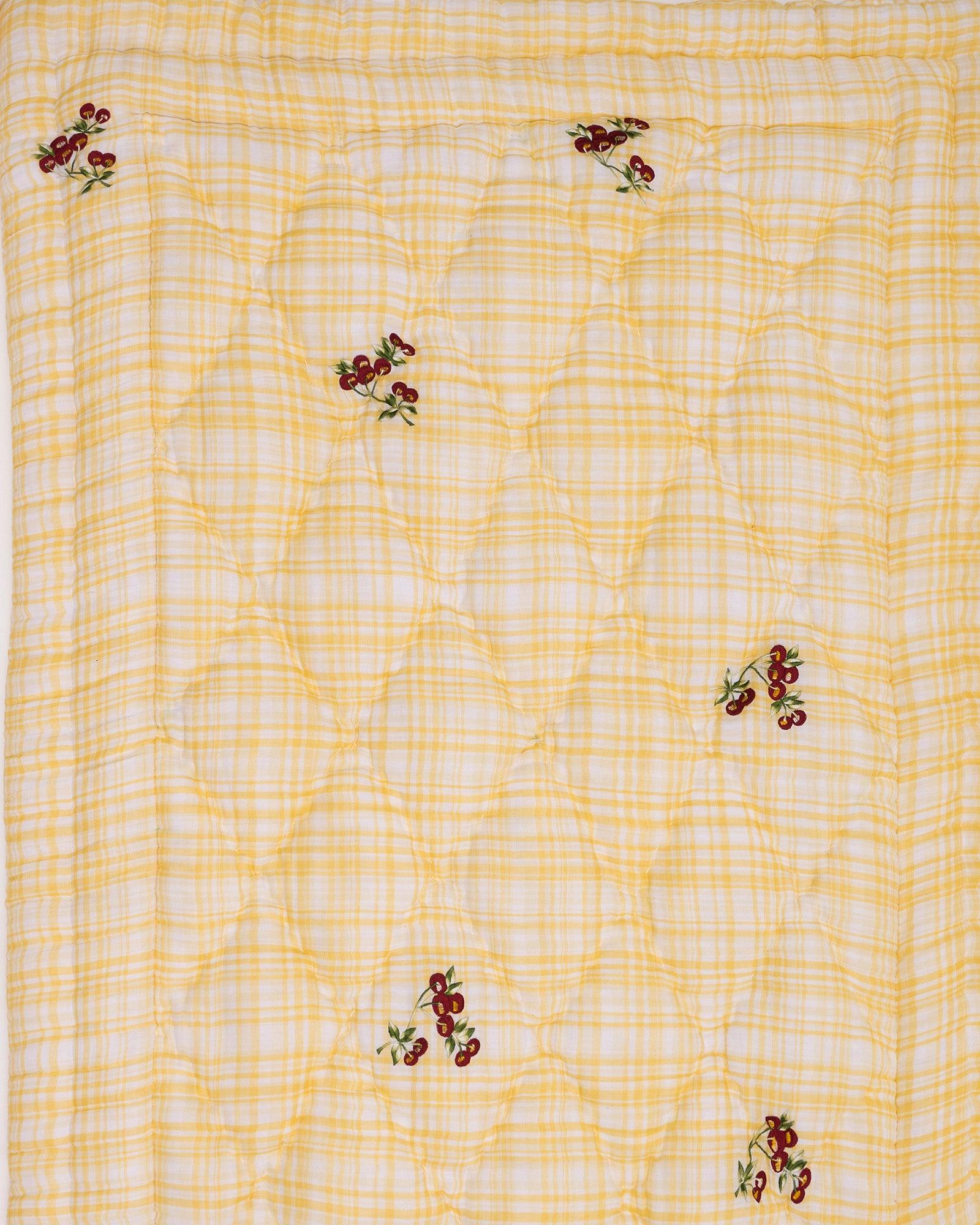 Delightful quilt features embroidered cherries & blends seamlessly with any nursery. Soft cotton & cozy filling for ultimate comfort.