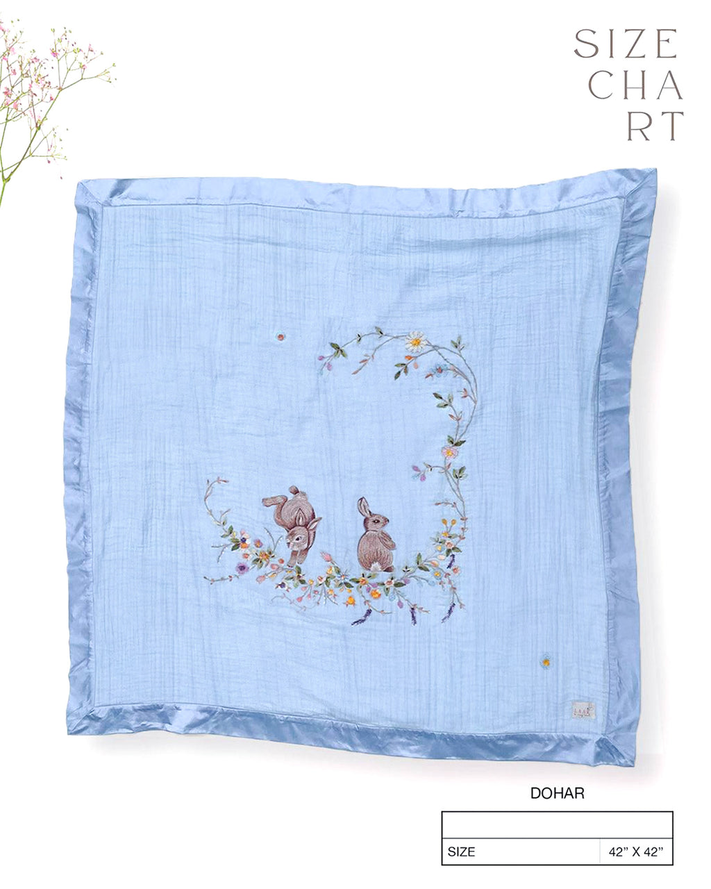 Soft fairytale blue bunny dohar for baby with delicate embroidery featuring two bunnies surrounded by a floral wreath. Made from lightweight, breathable fabric with a satin border—perfect for cozy naps and gentle on baby’s skin.