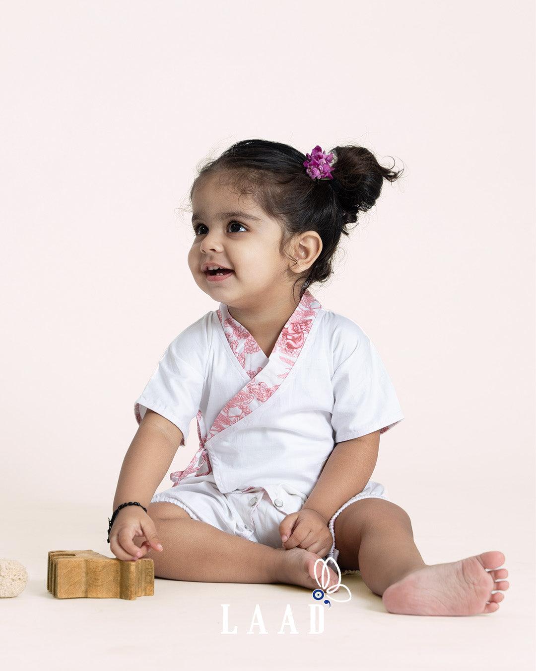 Sustainable feather white bubble romper. Kimono design, adj straps, 100% cotton. Made in India by Laad.