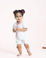 Sustainable feather white bubble romper. Kimono design, adj straps, 100% cotton. Made in India by Laad.