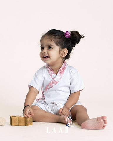 toddler child wearing soft white kimono style , with printed fashion collar.
