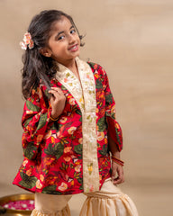Girl wearing a handcrafted floral red kimono style top with embroidered neckline and flared ivory sharara pants – ethnic festive kidswear by LAAD