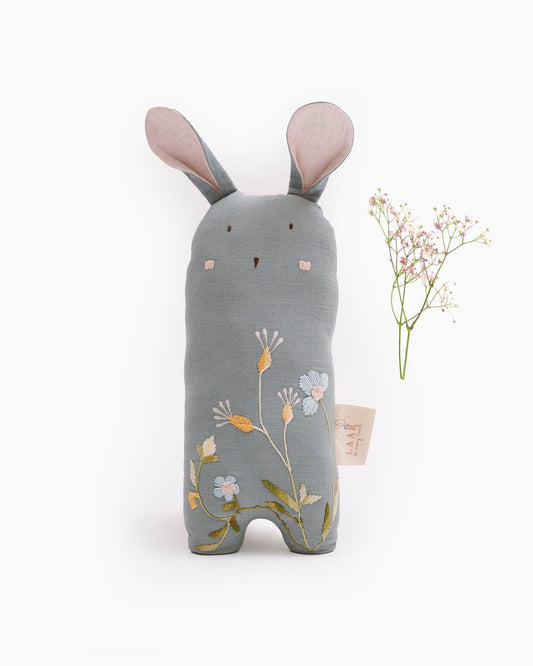 Meet Kaku, the cuddly bunny for tiny joys! Made with muslin & hand-embroidered details, Kaku offers comfort & support at playtime or sleep time