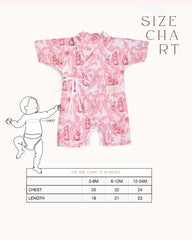 A premium cotton Kimono Romper with a whimsical bunny wonderland print in soothing pink tones. Featuring side tie closures for easy dressing and snap buttons at the crotch for quick diaper changes, this wrap-style romper offers a snug and adjustable fit. Made from 100% natural cotton