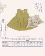 LAAD`S kid in Titalee moss green dress by Laad India, featuring delicate floral embroidery, an eyelet lace bodice, and a gingham checkered dress. A perfect blend of vintage elegance and modern comfort for your little one