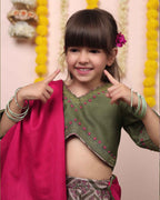 Moss green lehenga, blouse, dupatta. Silk chanderi, cotton mulmul lining. Hand-embroidered, badla work, ari-handwork. Paisley prints, beads and trims perfect wedding attire. by laadindia.com