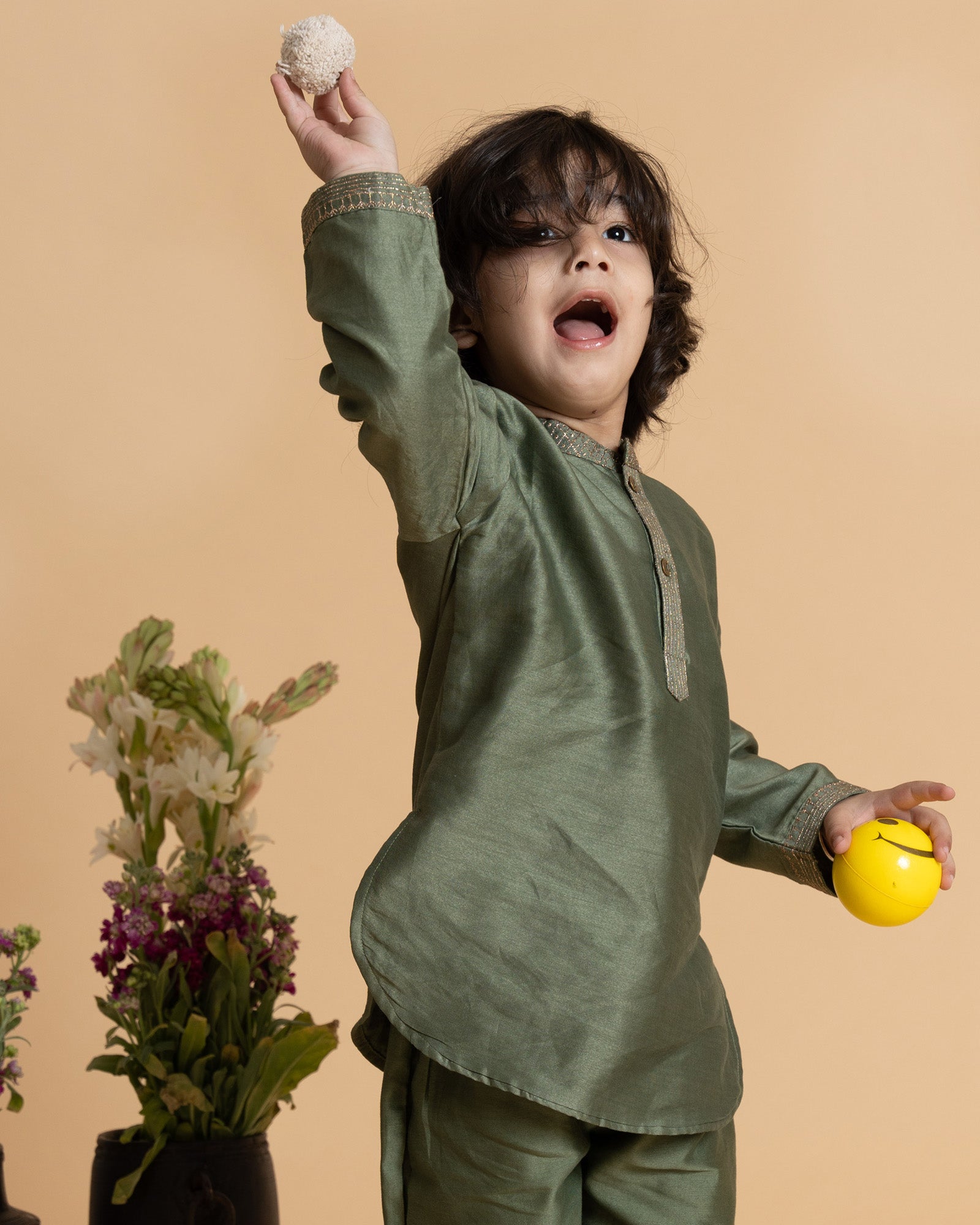 Little boy in a stylish moss green kurta set with delicate embroidery, showcasing festive elegance and comfort. Perfect ethnic wear for kids.