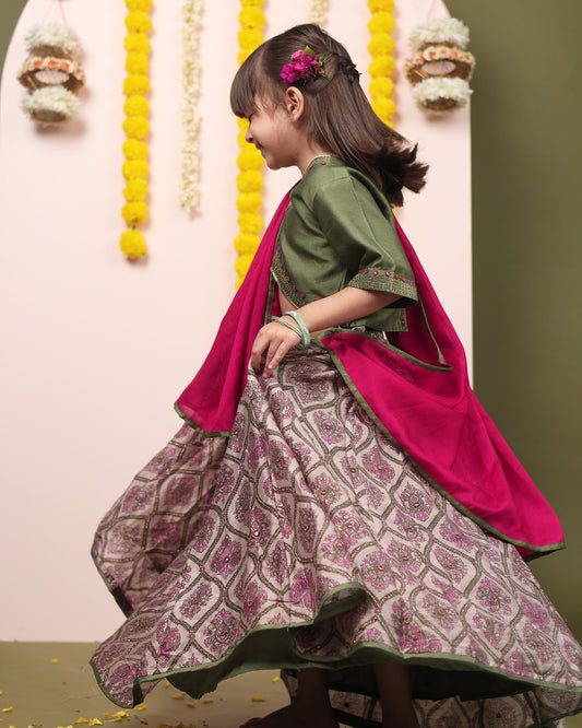 Indulge your child in elegance. Moss green lehenga, blouse, dupatta. Silk chanderi, cotton mulmul lining. Hand-embroidered, badla work, ari-handwork. Paisley prints, beads and trims perfect wedding attire. by laadindia.com