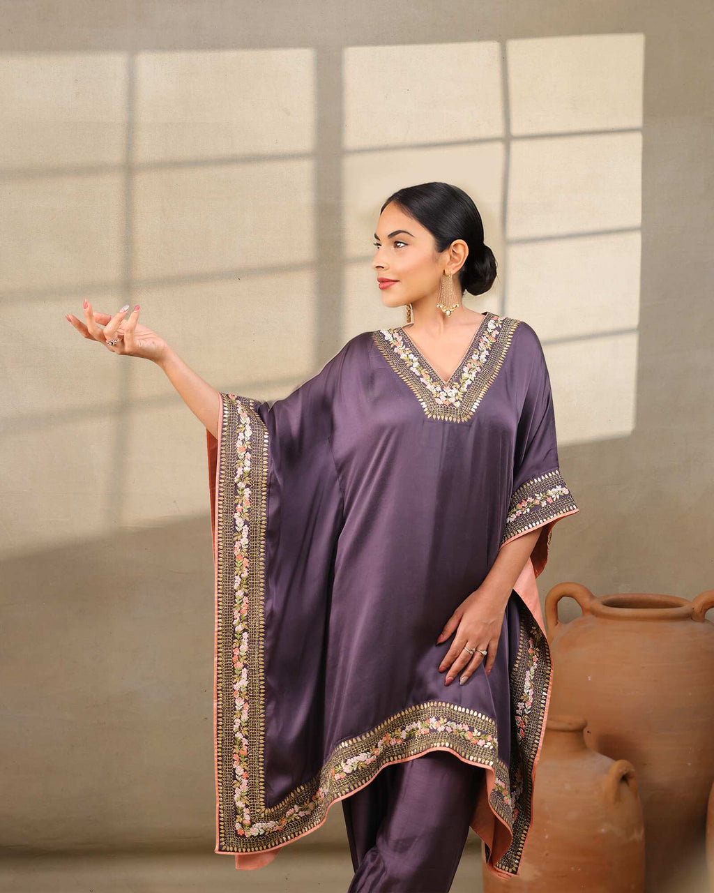 Plum purple embroidered kaftan with gold floral details, paired with dhoti pants – elegant festive wear outfit for weddings and diwali party