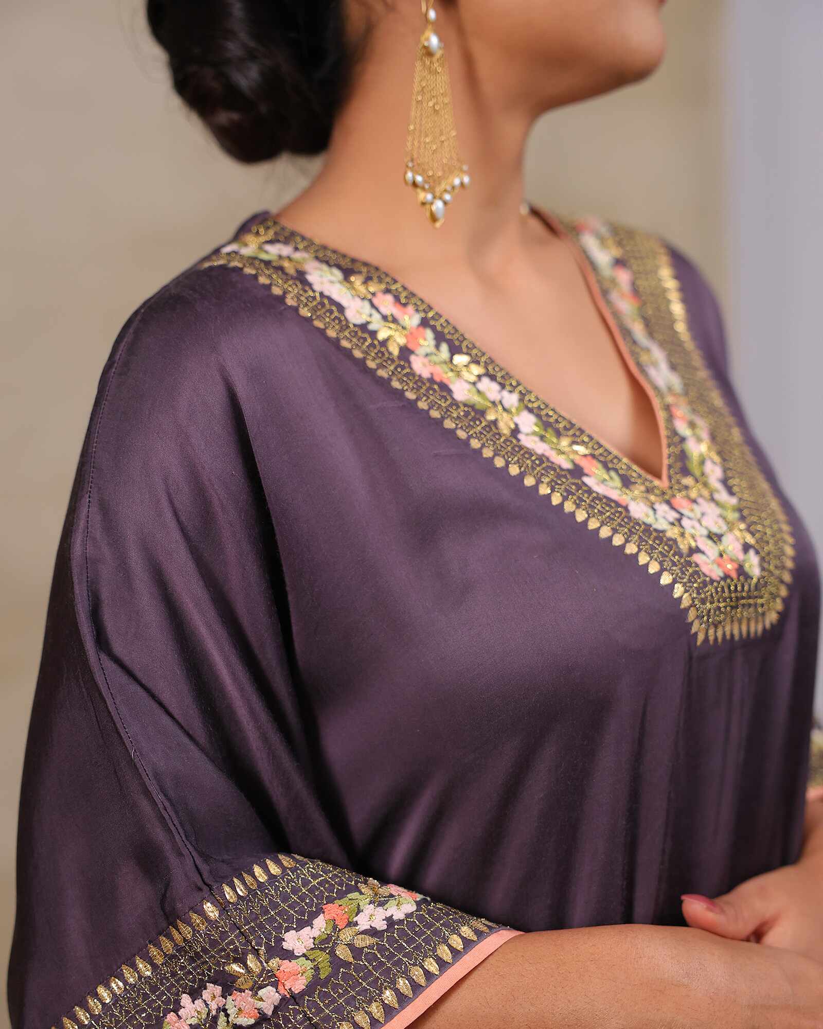 Plum purple embroidered kaftan with gold floral details, paired with dhoti pants – elegant festive wear outfit for weddings and diwali party
