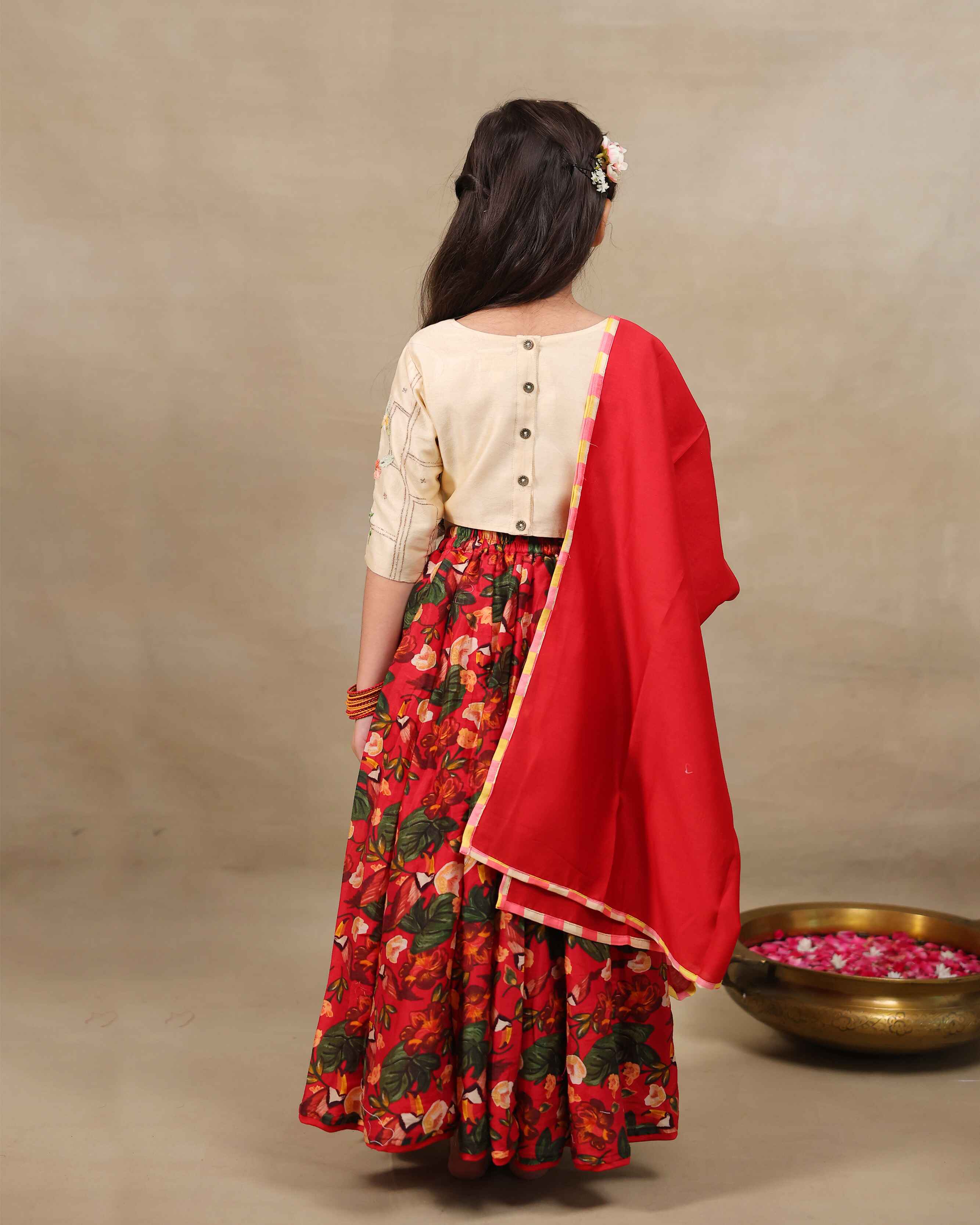 Young girl wearing LAAD’s  floral red rose lehenga set with embroidered perfect net lehenga choli with dupatta girls festive wear for kids, perfect for weddings and celebrations