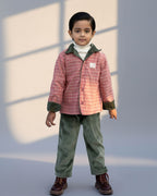 sage shoal co-ord set by LAADINDIA.com, featuring a child dressed in a navy blue velvet co-ord with floating fish embroidery, front-open top with contrast check cuffs, and matching trousers for winter festive wear.