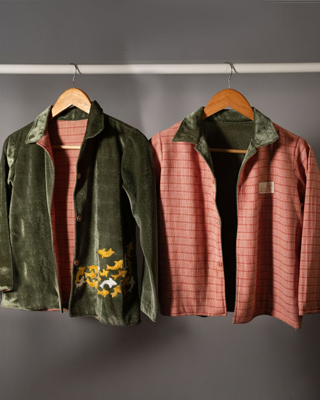 sage shoal co-ord set by LAADINDIA.com, featuring a child dressed in a navy blue velvet co-ord with floating fish embroidery, front-open top with contrast check cuffs, and matching trousers for winter festive wear.