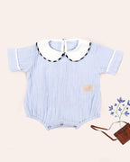 LAAD `S toddler is wearing  a cute white collar & refreshing blue romper perfect for summer. 