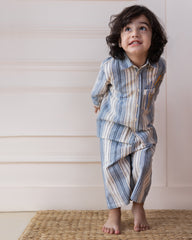 laad`s Kids' striped co-ord set with a long-sleeve shirt and shorts, featuring soft beige and gray tones. Embroidered seahorse detail adds a playful touch. Lightweight, breathable fabric for all-day comfort.