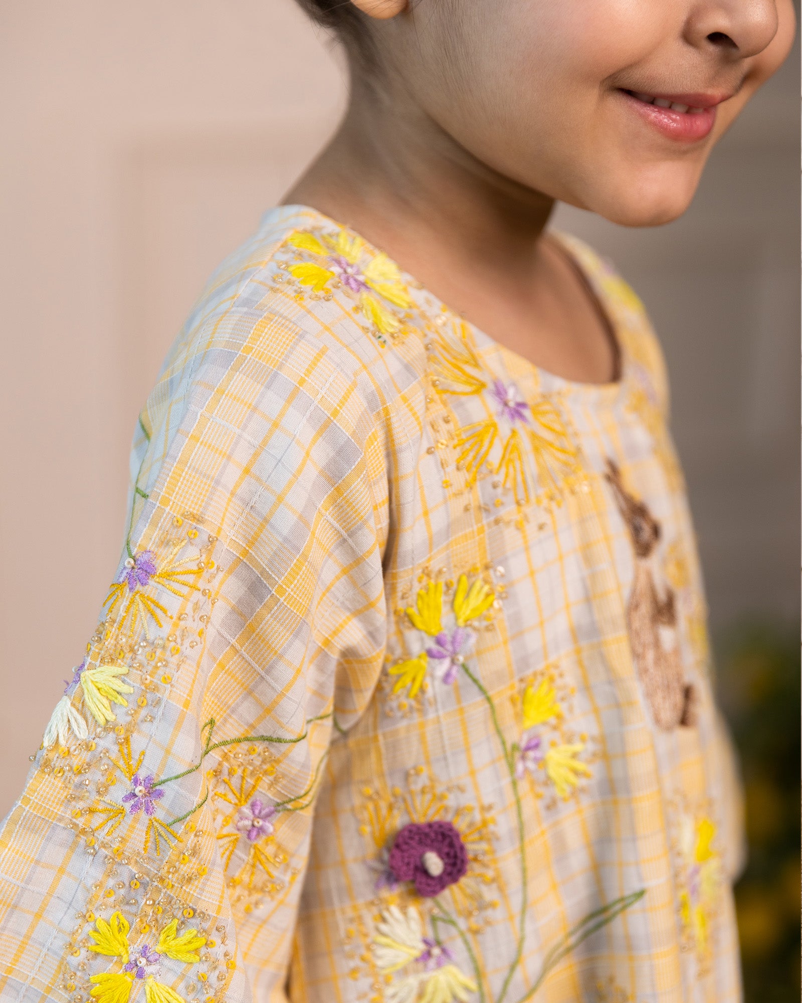 Full-length sunlit ghera dress lehenga style with hand-embroidered crocheted flowers, umbrella sleeves, and shimmering sequin ari work for occasions