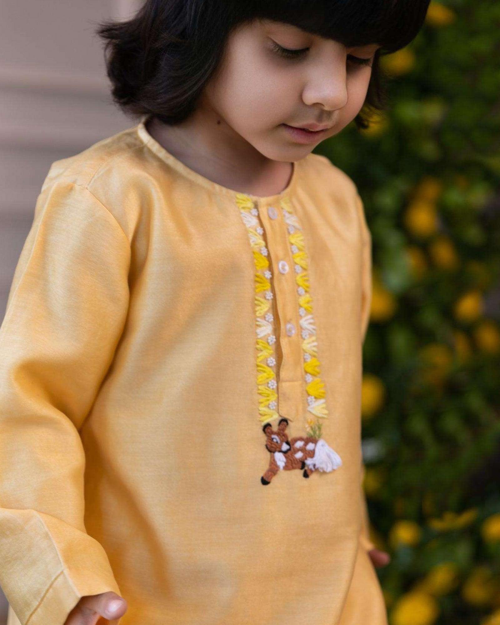 Elegant yellow kurta pyjama set for kids by Laad India, featuring delicate beadwork, intricate hand embroidery of a bambi, and a soft cotton lining for ultimate comfort. Perfect ethnic wear for festive occasions and celebrations