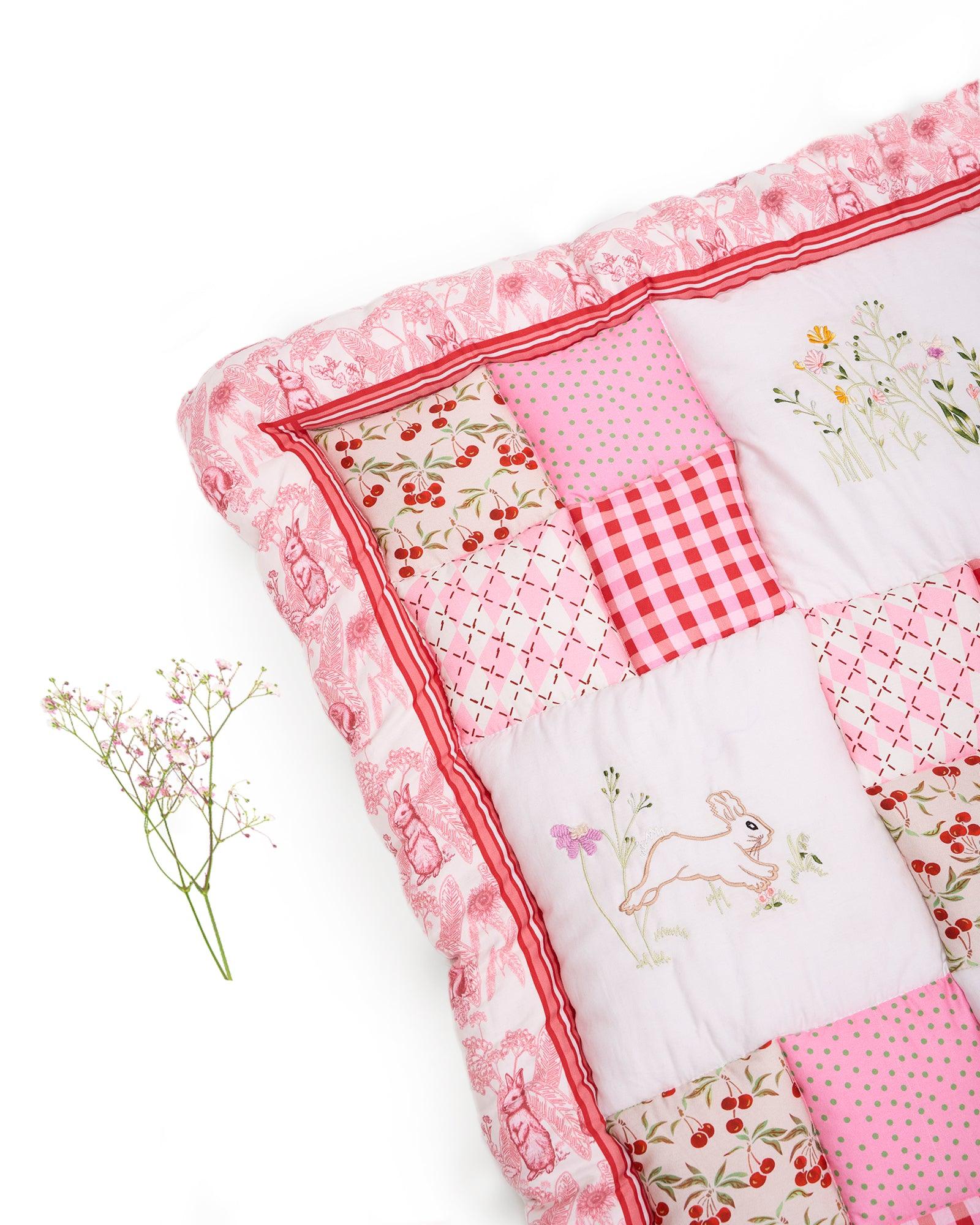 White Rabit quilt features playful rabbits & vibrant scarlet for a touch of magic. Soft cotton & cozy fiber filling for ultimate comfort. Machine wash gentle cycle at 30°C. Avoid harsh hardware, dry in shade