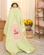 soft green muslin baby dohar featuring hand-embroidered floral details and a bambi nested on a pastel pink patch. Lightweight and breathable, ideal for keeping babies snug and cozy.