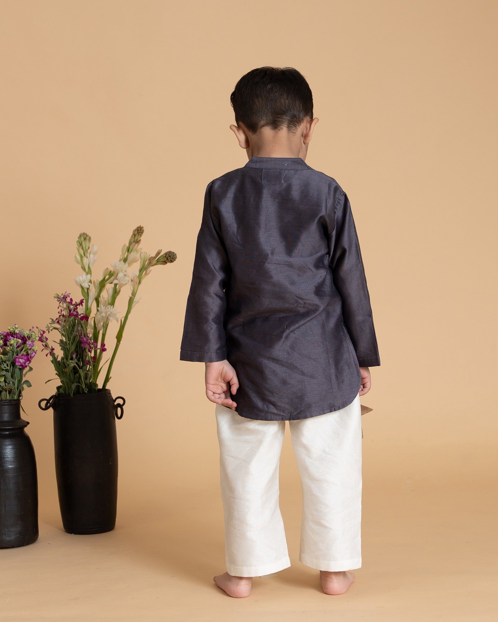 Young boy wearing LAAD India vintage grape kurta with embroidered detail, paired with cream pants a perfect boy`s ethnic wear kurta pyjama set