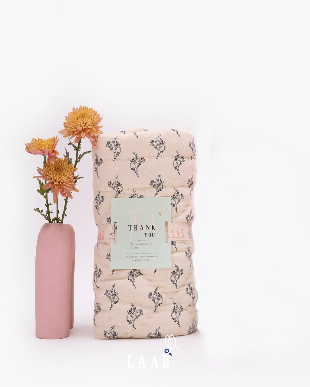 Hand-stitched White Jasper Quilt made from 100% muslin fabric, featuring an all-over delicate floral print on a soft cream base — lightweight, breathable, and perfect for cozy comfort.