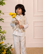 laad`s kid in Classic white cotton shirt  paired with a 100% cotton waistcoat with butterfly embroidery at the back . Perfect boy`s party wear